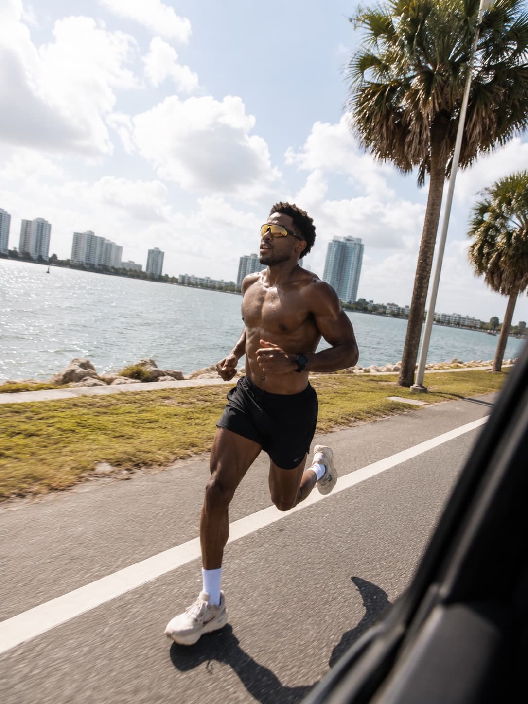 A runner training beside the waterfront
