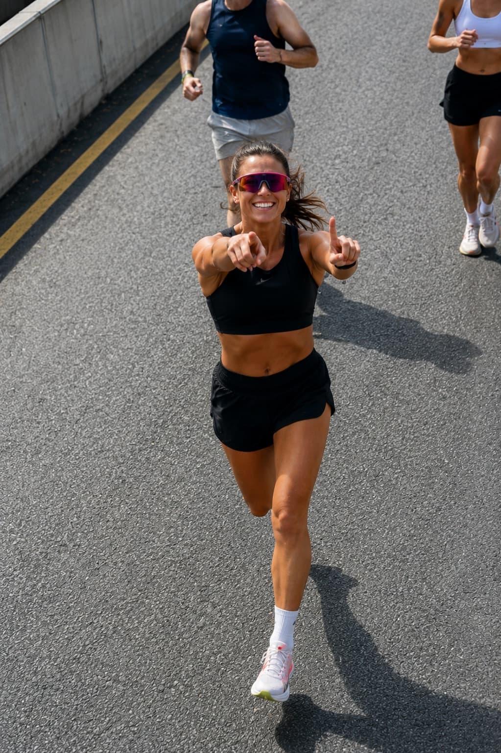 A smiling runner moving toward the finish